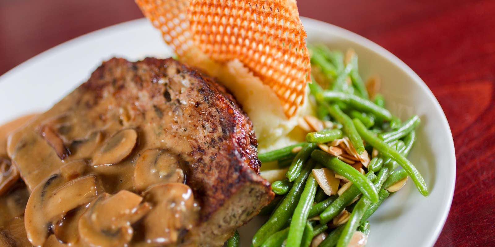 Turkey Meatloaf dish with mushroom sauce and green beans